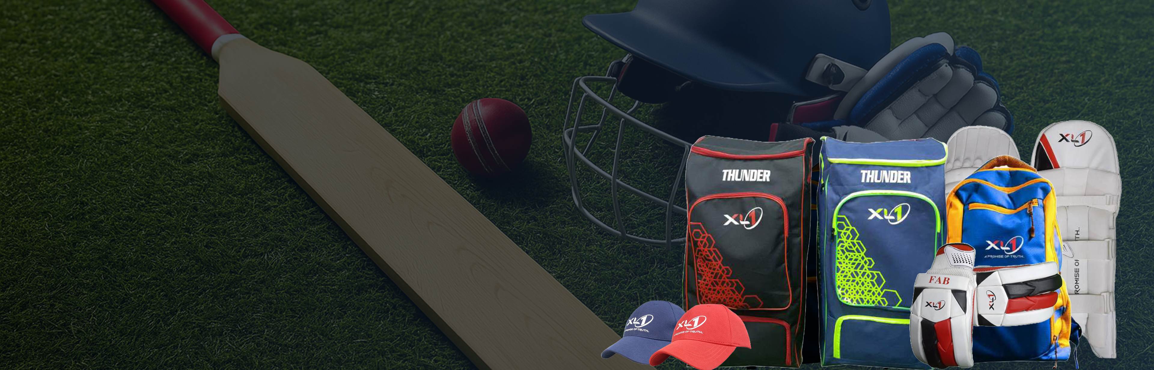 XL1 Thunder cricket equipment collection with bat, ball, bags and protective gear on grass field